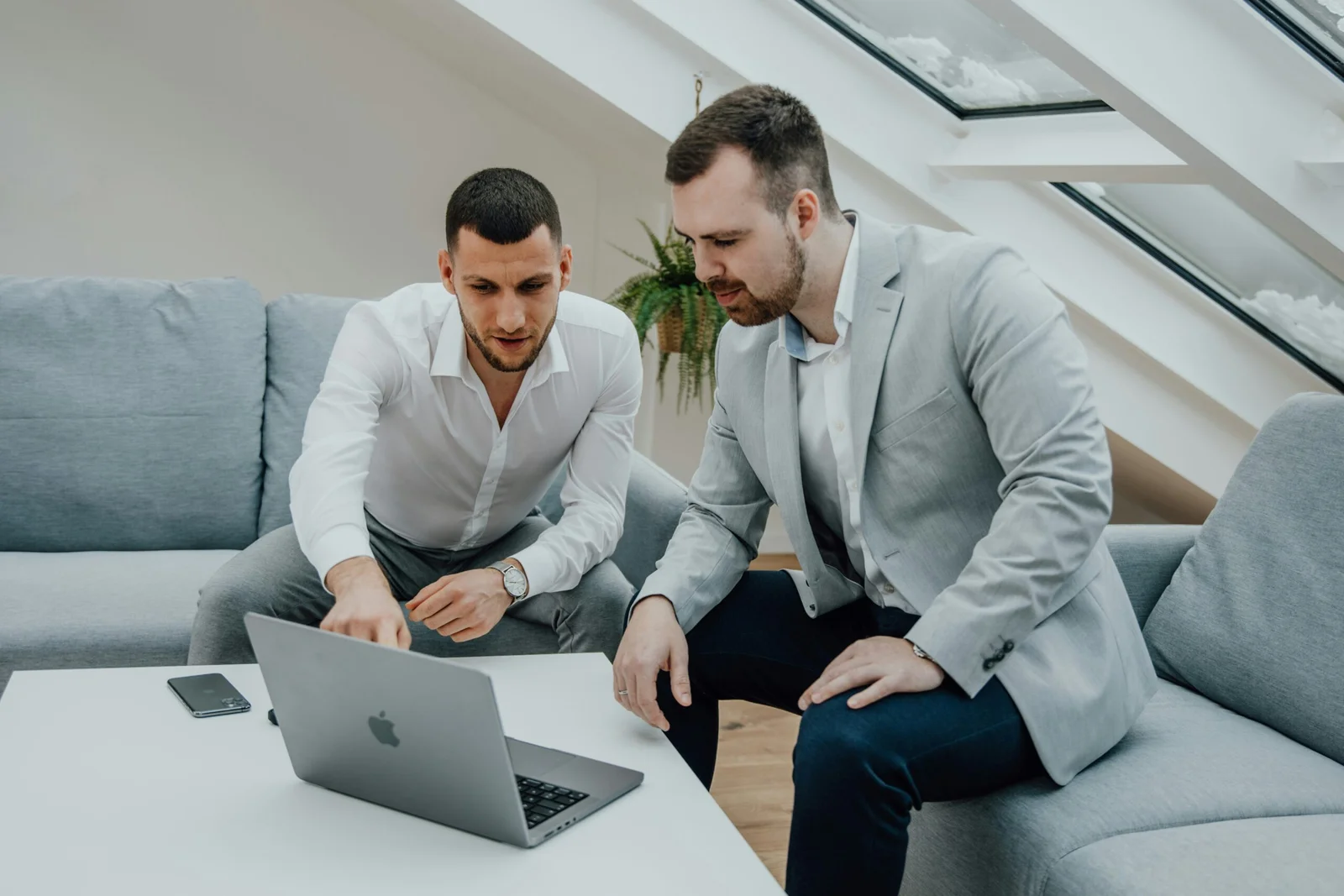 Business professionals working together with technology